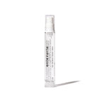 Clear spray bottle with white label on a white background