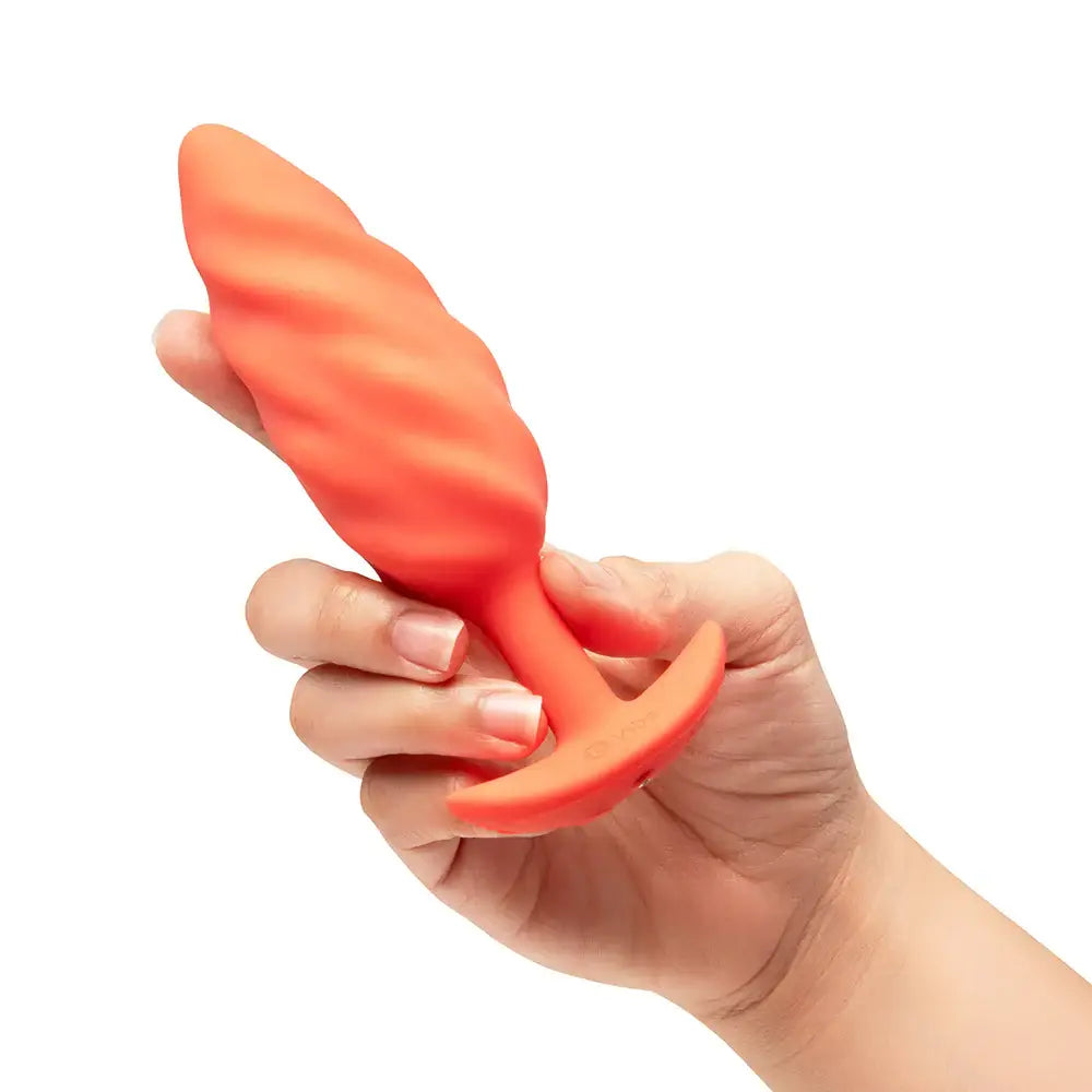 B-Vibe™ b-Vibe Swirl Texture Plug, Medium Vibrating Silicone Butt Orange