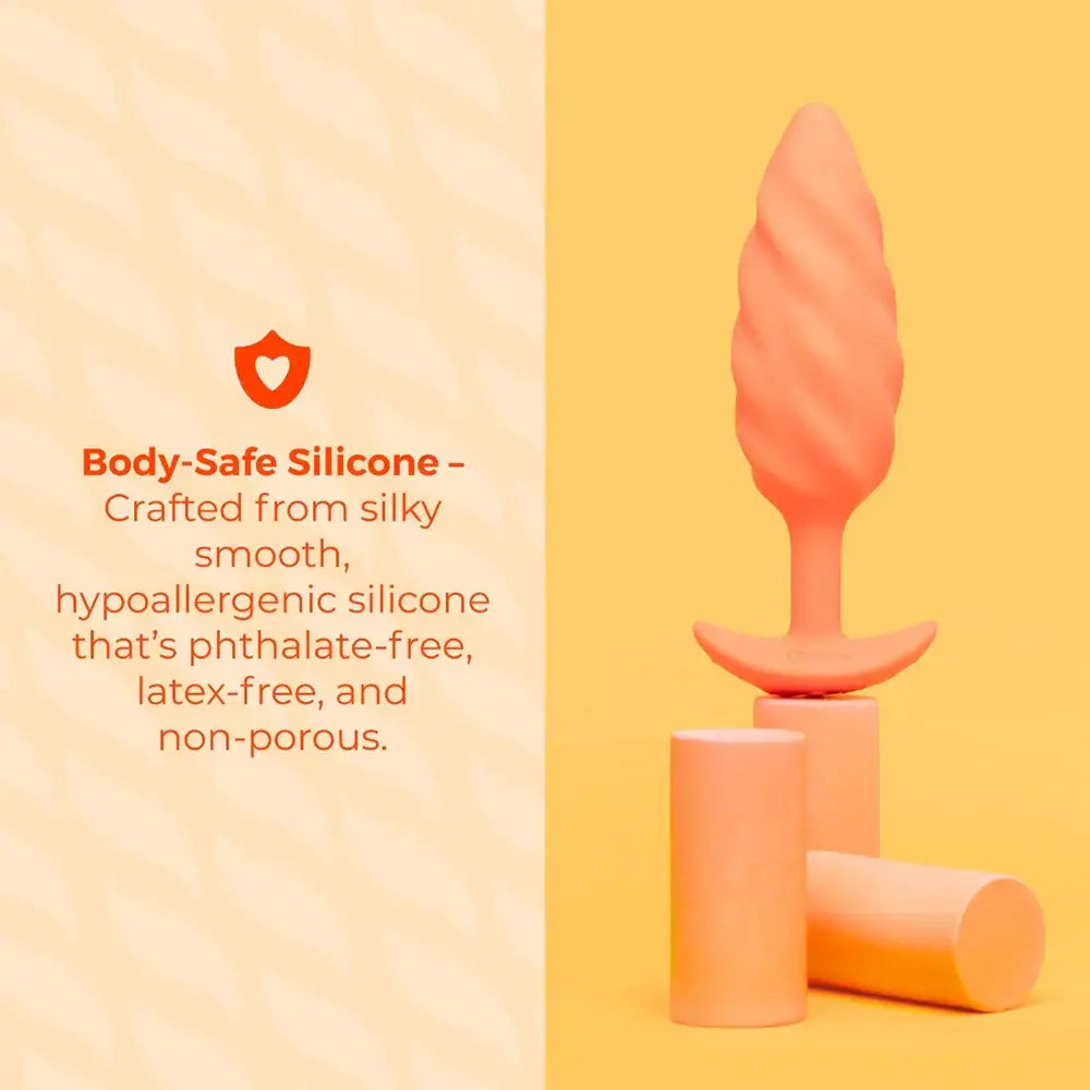 B-Vibe™ b-Vibe Swirl Texture Plug, Medium Vibrating Silicone Butt Orange