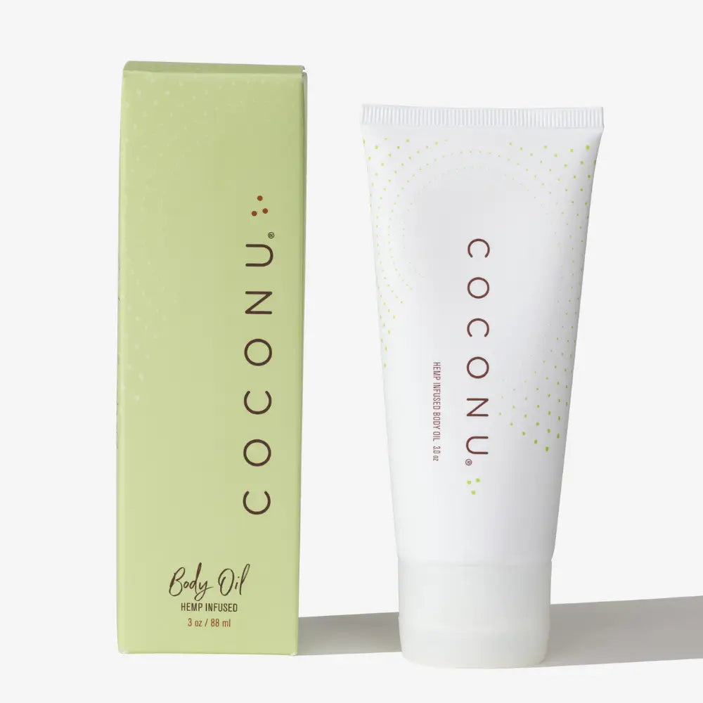 COCONU baby oil packaging including a tube and box on a white background