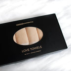 Box of Common Confidential Love Towels on a white background