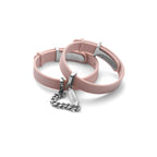 Pink dog collar with silver tag on a white background