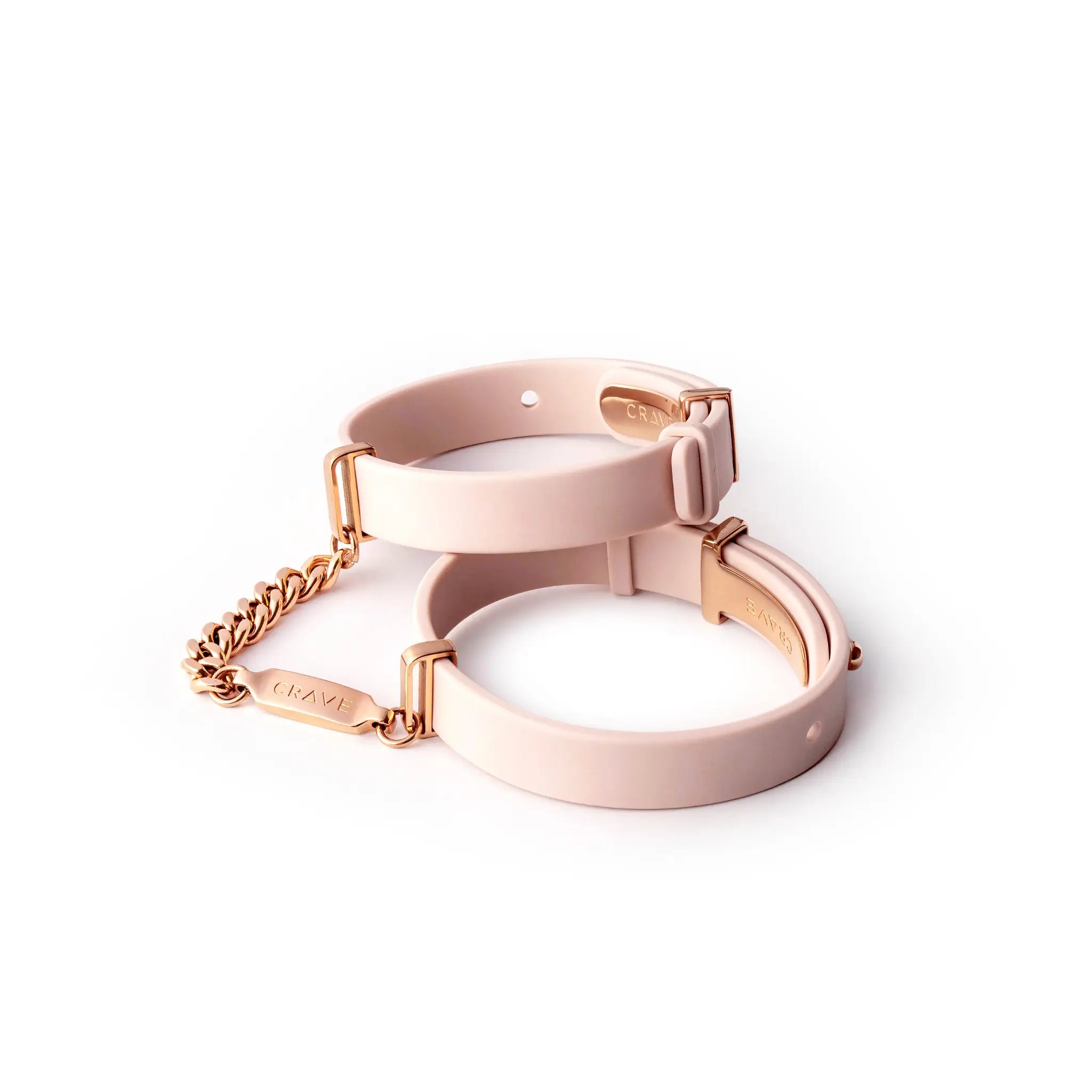 Pink and rose gold compact mirror on a white background