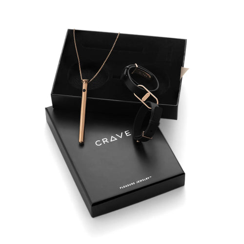 Jewelry set including a necklace, bracelet, and sunglasses in a 'Crave' box on a white background