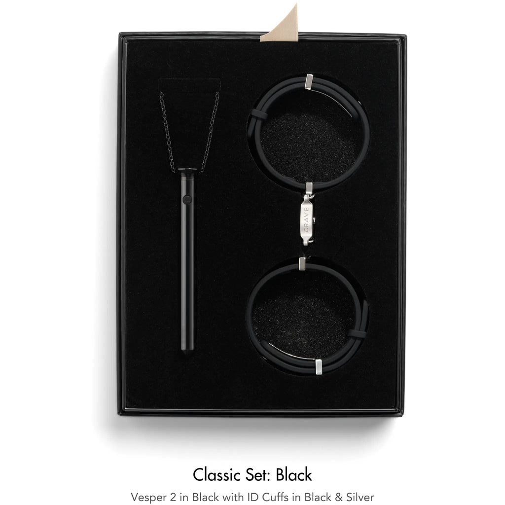 Black jewelry set with 'Vesper 2' and 'ID Cuffs' in a black box on a white background.
