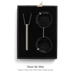 Jewelry set with necklace and cuffs in a black box, labeled 'Classic Set: Silver'.