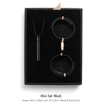 A black jewelry gift set in a black presentation box, featuring a black pendant necklace, a black ID cuff with rose gold hardware, and a black watch with a matching rose gold clasp. The set is displayed on a clean white background with text below reading 'Mini Set: Black'.