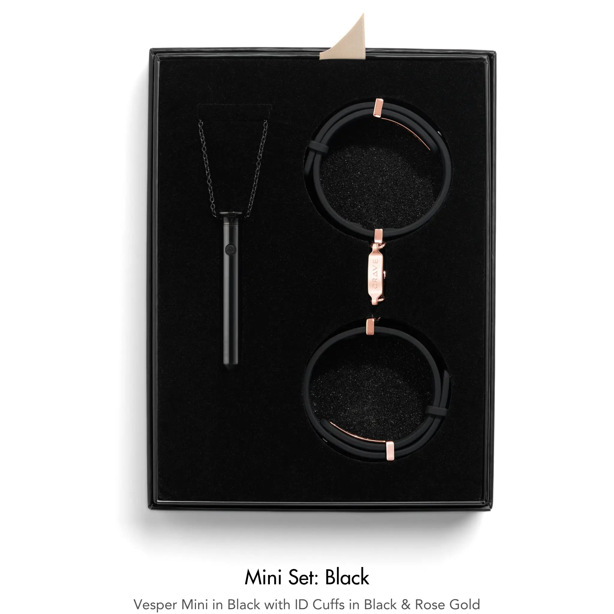 A black jewelry gift set in a black presentation box, featuring a black pendant necklace, a black ID cuff with rose gold hardware, and a black watch with a matching rose gold clasp. The set is displayed on a clean white background with text below reading 'Mini Set: Black'.
