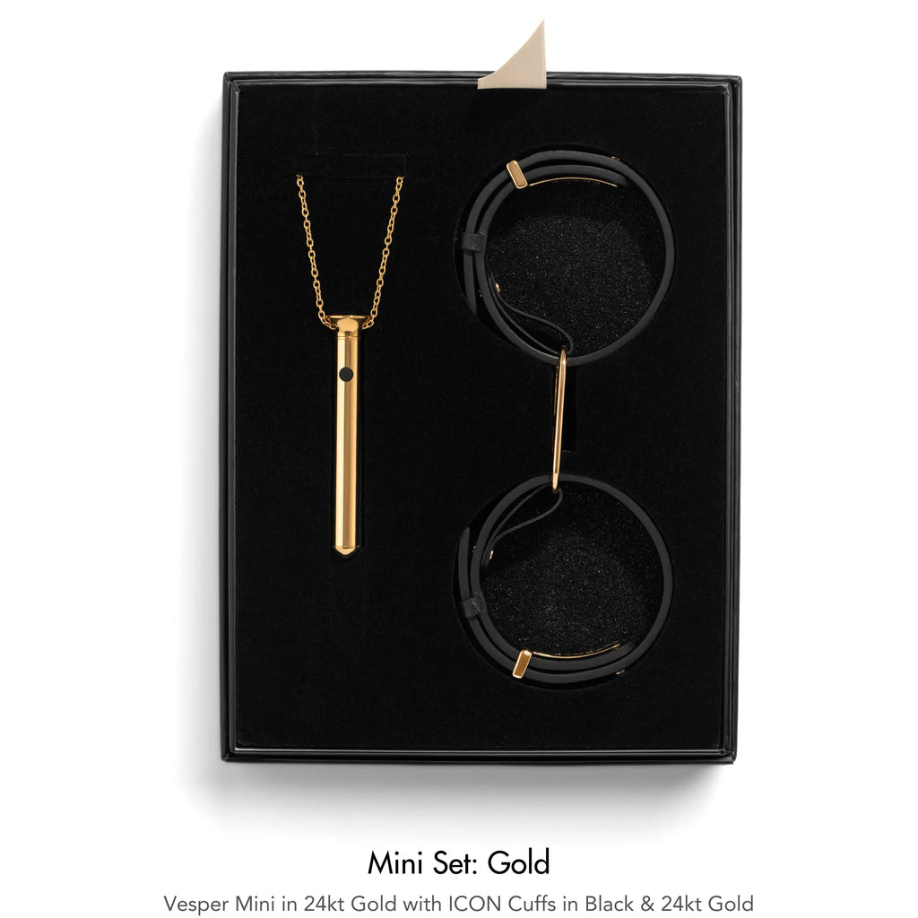 Jewelry set with necklace and cuffs in a black box, labeled 'Mini Set: Gold'.