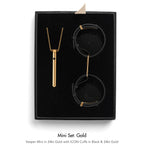Jewelry set with necklace and cuffs in a black box, labeled 'Mini Set: Gold'.