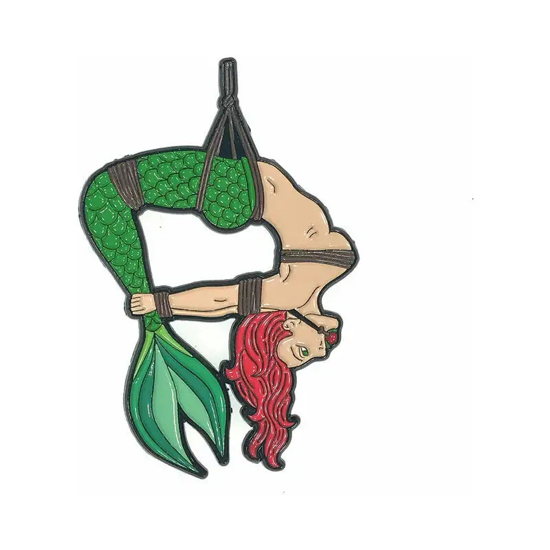 Mermaid with green tail and red hair in a harness on a white background