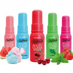 Five bottles of 'Good Head Booty Licker Spray' in different flavors on a white background.