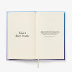 Open book with text inside on a white background