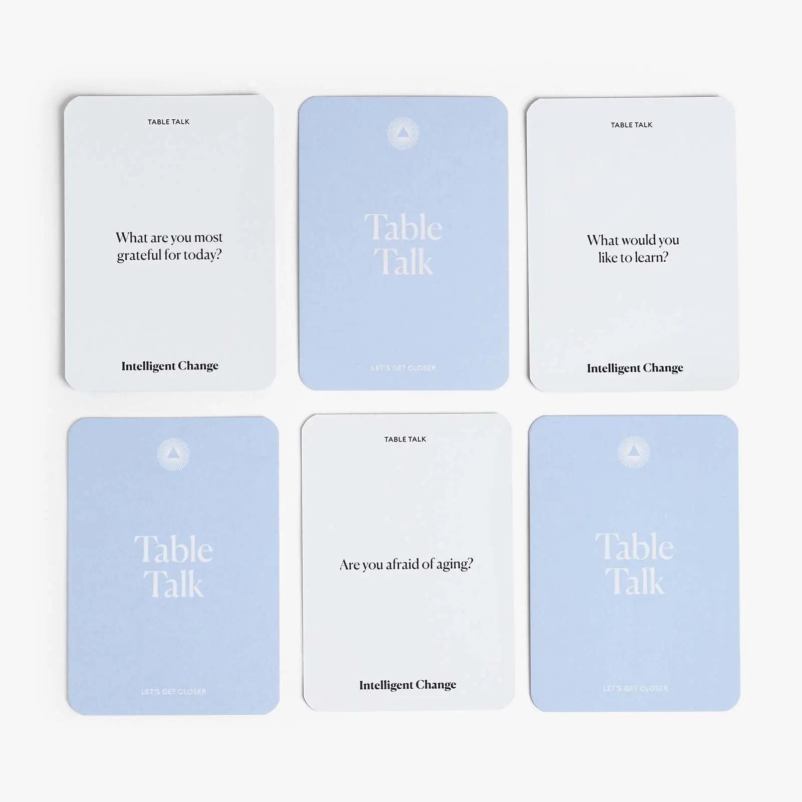 Set of six 'Table Talk' cards with questions on a white background