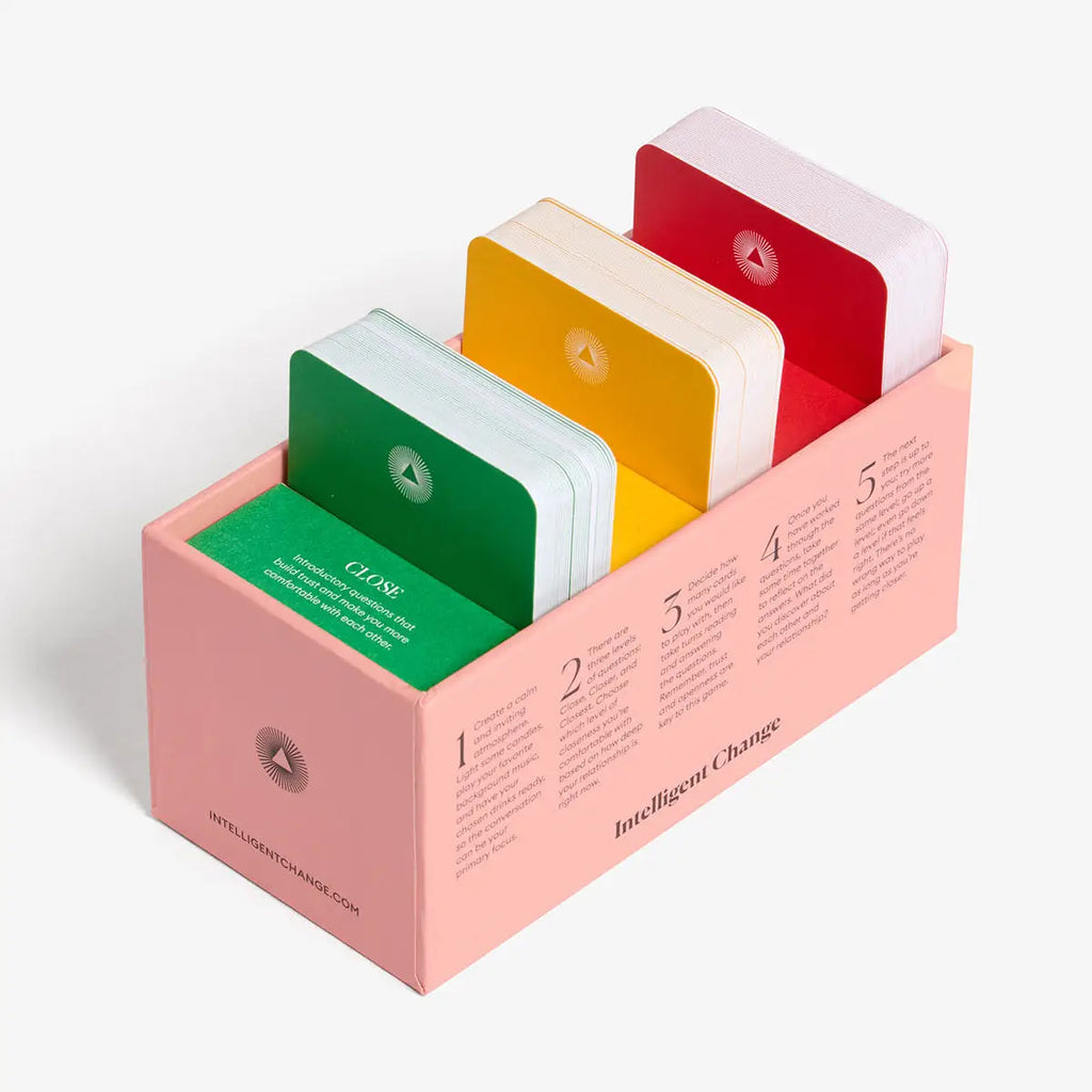 Colorful flashcards in a pink holder on a white background