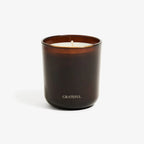 Dark brown candle with 'GRATEFUL' text on a white background