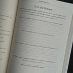 Open book with text on a black background
