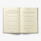 Open book with text on a white background