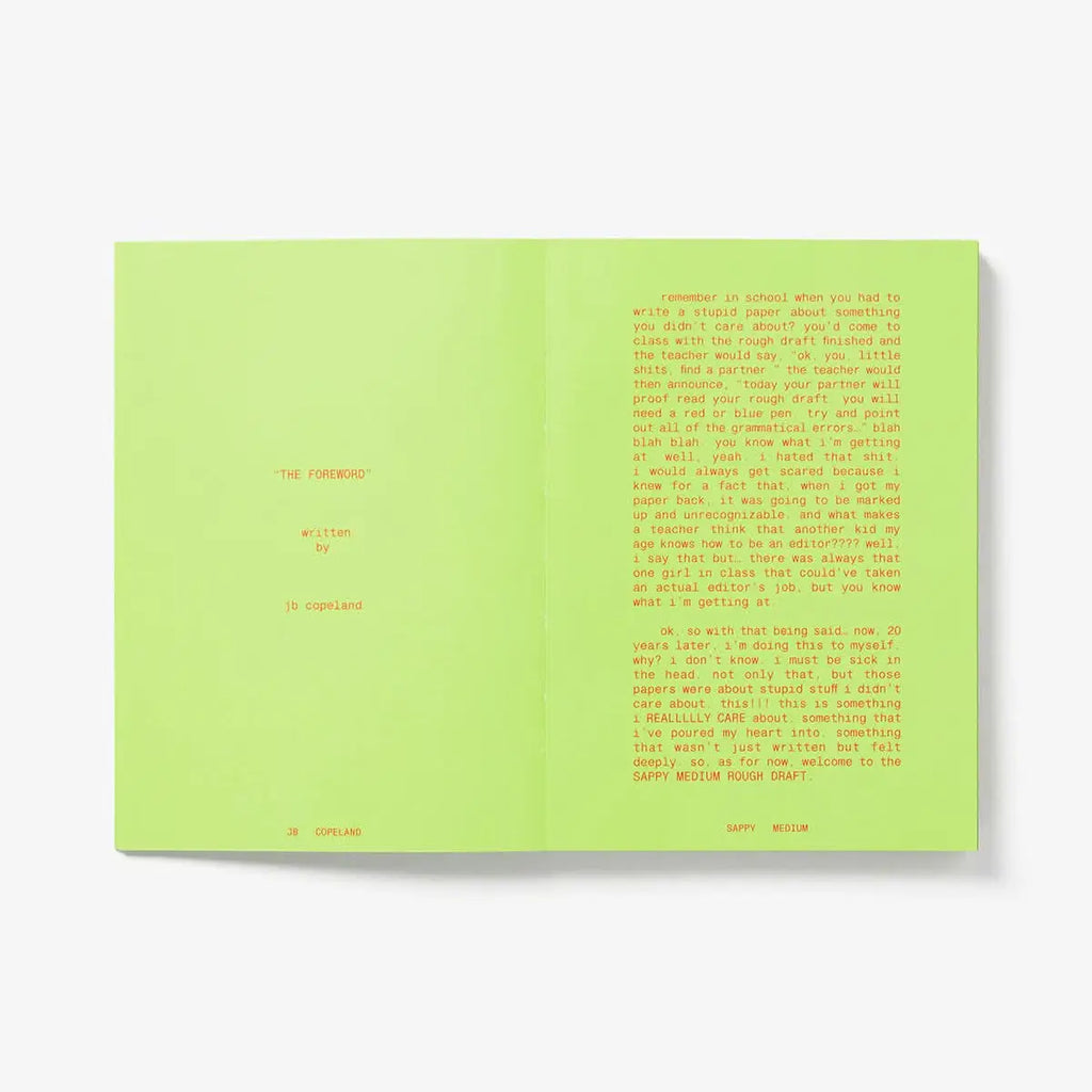 Open book with green pages on a white background