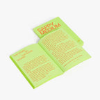 Open book with text on green pages on a white background