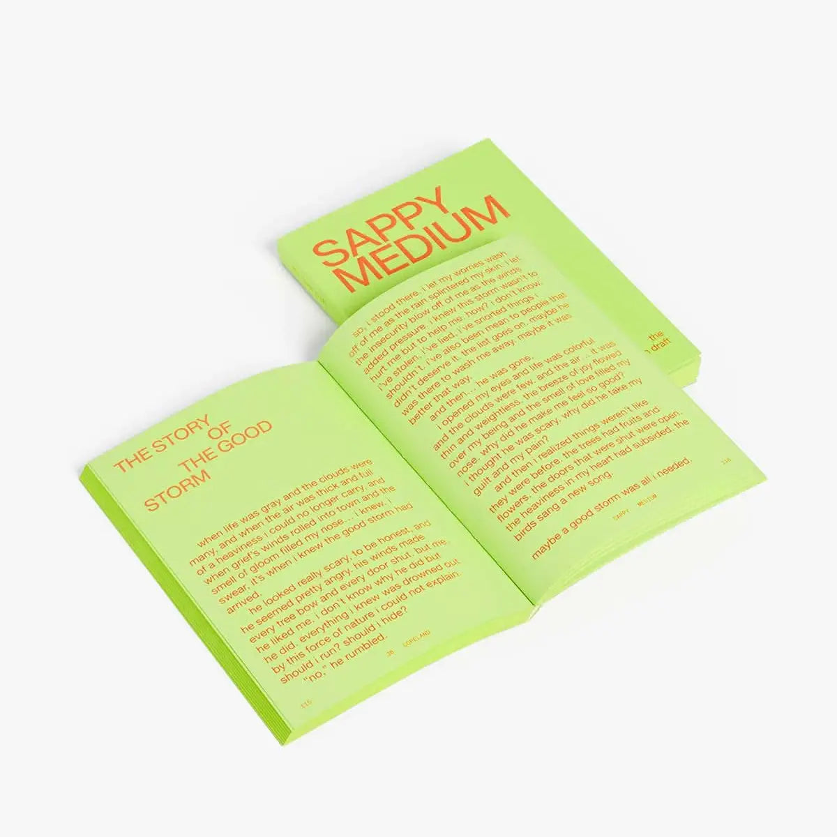 Open book with text on green pages on a white background