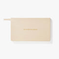 Beige planner with 'the weekly life planner' text on a white background