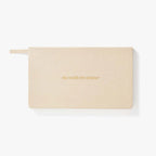 Beige planner with 'the weekly life planner' text on a white background