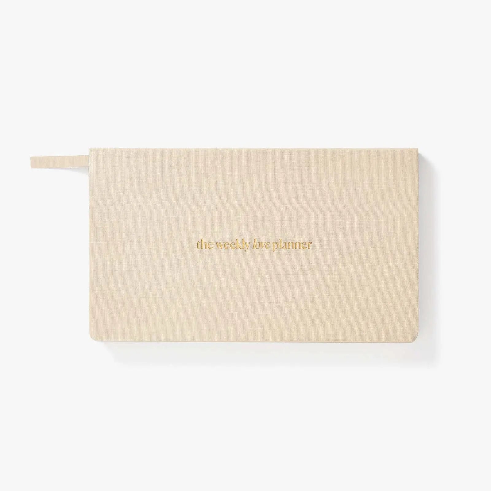 Beige planner with 'the weekly life planner' text on a white background