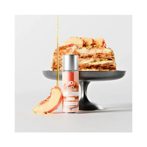 Bottle of JO Bake Shoppe lubricant with peach cobbler in the background