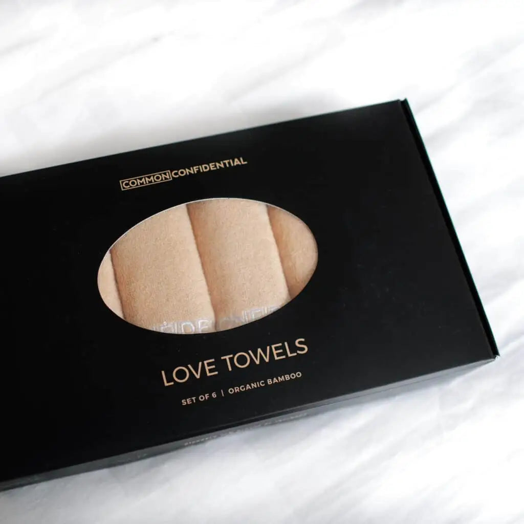 Box of Common Confidential Love Towels on a white background