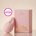 Pink product and packaging with 'mila' branding on a beige background, featuring 'As Loved by Nylon' logo.