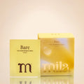A yellow sachet and its matching yellow box packaging for Bare Collagen Intimate Wipes by mila, in the Vanilla scent, set against a warm beige gradient background with a soft reflection below.