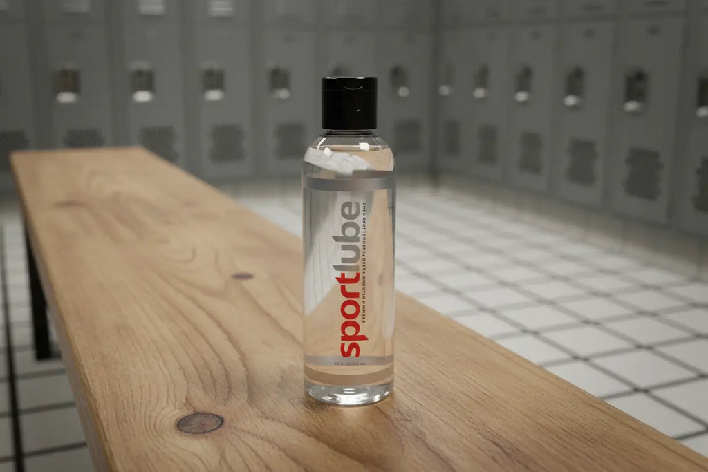 Bottle of SportLube on a wooden bench with lockers in the background