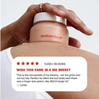 Hand applying a jar labeled 'Medicine Mama' to skin with a customer review overlay.